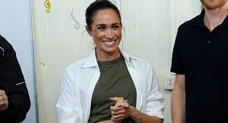 Down-to-earth Duchess! Meghan has no time to worry about creased trousers as she proudly focuses on her work in Jordan - with no entourage and no 6ft ironing board like Andrew's valet used to carry around