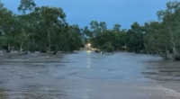 The Todd River was overflowing after heavy rain fell in Alice Springs last night.