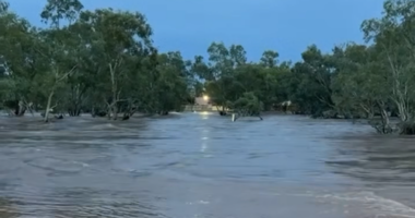 The Todd River was overflowing after heavy rain fell in Alice Springs last night.