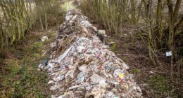 Fly-tippers dump 100ft river of rubbish near dual carriageway