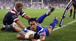 SYDNEY, AUSTRALIA - OCTOBER 3: Matt Utai of the Bulldogs dives over for a try during the NRL Grand Final  between the Sydney Roosters and the Bulldogs held at Telstra Stadium, October 3, 2004 in Sydney, Australia. (Photo by Chris McGrath/Getty Images) *** Local Caption *** Matt Utai
