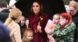 Her royal hugness! Kate gets a cuddle from an adorable young royal fan who doesn't want to let go of the Princess on visit to Wales