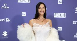 Irina Shayk showcases her incredible figure in lace mini dress