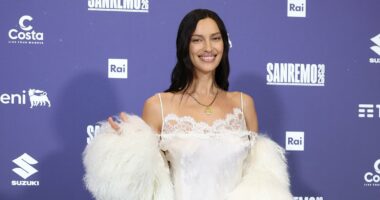 Irina Shayk showcases her incredible figure in lace mini dress