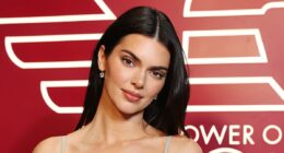 Kendall Jenner stuns in a £700 silver Reine dress during MFW