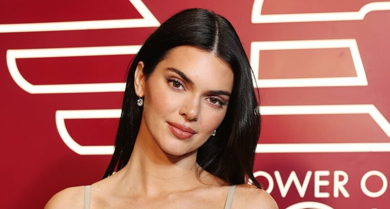 Kendall Jenner stuns in a £700 silver Reine dress during MFW