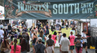 Festival visitors enter one of the main entrances during day one of the Byron Bay Bluesfest on April 14, 2022 in Byron Bay, Australia. The music festival returns after a two-year break due to the coronavirus pandemic.