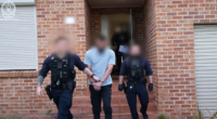 Man charged with terrorism offence after traffic stop leads to raid on Sydney home