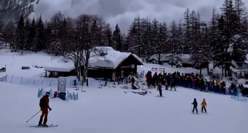 Moment avalanche cascades down mountain in Italy skiers watch on