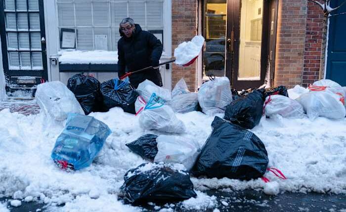 Northeast US scrambles to clear piles of snow as new storm descends on the region