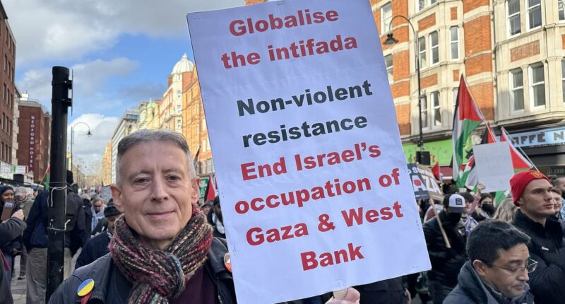 Peter Tatchell is arrested for 'globalise the intifada' banner at pro-Palestine demo where police battle to keep rival protesters apart
