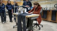 Princess of Wales beams as she helps create special pair of trousers for William during visit to traditional textile firms - all while sporting vintage Welsh wool coat