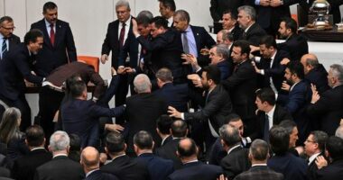 Turkey's ruling party and opposition lawmakers clash over the appointment of Istanbul Chief Prosecutor Akin Gurlek as justice minister at the parliament in Ankara, Turkey, Wednesday, Feb. 11, 2026. (Ugur Yildirim/DIA Photo via AP)