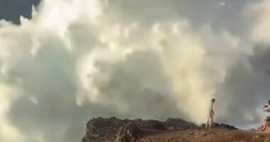 Selfie-taking tourists cheat death when they are hit by monster wave