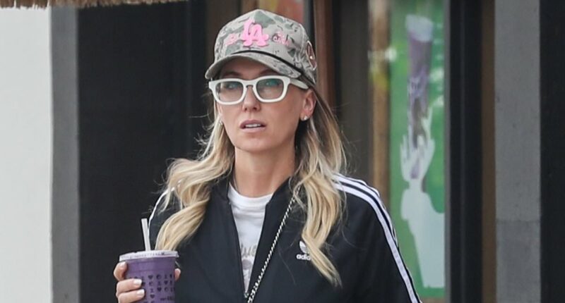 Singer divorcing producer named in Epstein files looks glum in LA