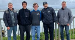 Surfers heralded as heroes after saving family whose boat capsized