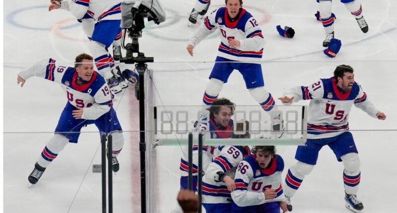 US beats Canada 2-1 in overtime to win first men's hockey championship at the Olympics since 1980