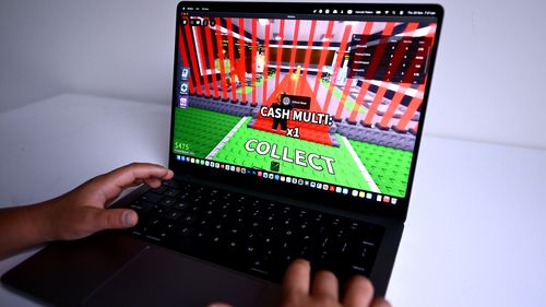 A child is seen playing a game on the Roblox platform. The platform will not be included in Australia's social media ban.