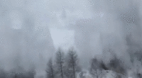 Video shows terrifying moment avalanche slams into passenger train near ski resort