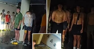 Viral disturbing bodycam footage shows dozens of shirtless, blindfolded University of Iowa pledges covered in food in frat basement