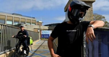 Stage name Sur Ronster an American content creator in his twenties specialising in electric bikes at Observatory Hill near the Sydney Harbour Bridge.