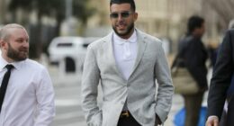 Businessman Adrian Portelli (centre) arrives at the Adelaide Magistrates Court, in Adelaide, Friday, September 5, 2025.