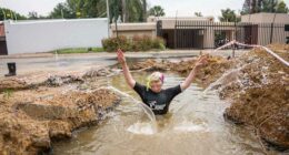 A South African politician goes snorkeling in a giant pothole to highlight city management failures