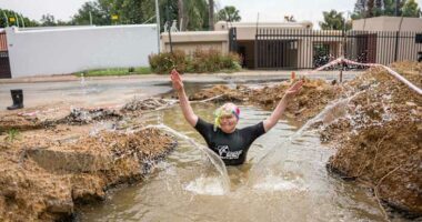 A South African politician goes snorkeling in a giant pothole to highlight city management failures