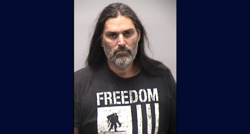 'A human skull': Agitated man charged with murder after 'talking about a cremation' leads to burned 'skeletal remains' being found on his property, authorities say