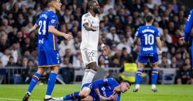 Antonio Rudiger escapes red card for 'one of the most brutal fouls ever seen' in shock Real Madrid defeat - as fans chant against Florentino Perez and ex-West Brom defender taunts Vinicius Jr
