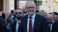 Australian prime minister heckled at mosque, called 'putrid dog' by protestors