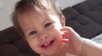 Baby girl is left fighting for her life after choking on a strawberry