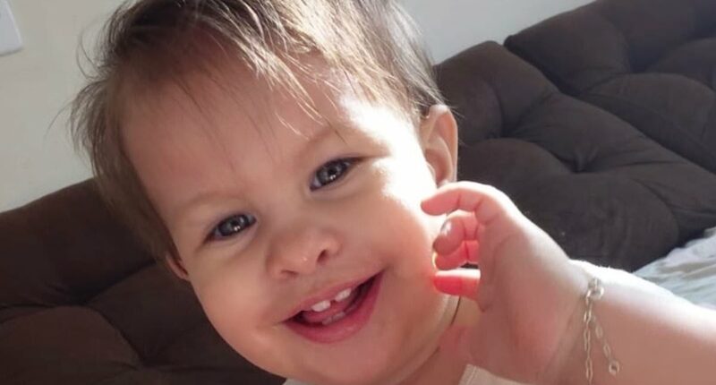 Baby girl is left fighting for her life after choking on a strawberry