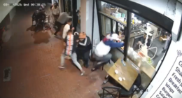 CCTV shows the moments the shots were fired and the men run into the building for cover.