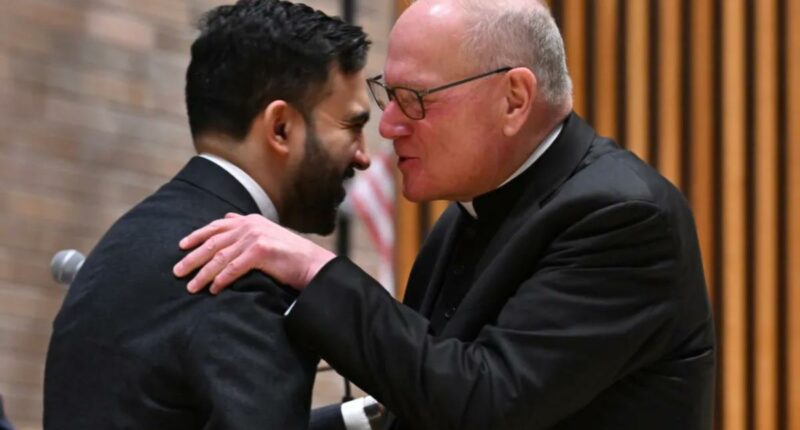 Cardinal Timothy Dolan whispers into Mamdani's ear at NYPD event â as ex-archbishop said he was 'ticked off' at mayoral snubs