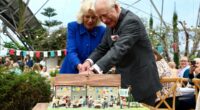 Charles and Camilla cut wonky slice of cake during Eden Project visit