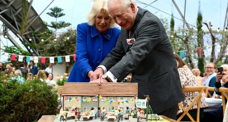 Charles and Camilla cut wonky slice of cake during Eden Project visit