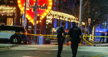 Gunman who shot two dead had 'photos of Iranian leaders' in home