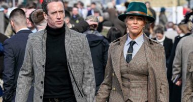 Hannah Waddingham holds hands with spine surgeon at Cheltenham