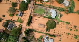 Hawaii's worst flooding in 20 years caused over $1BILLION in damage as crews desperately search for woman swept away in deluge