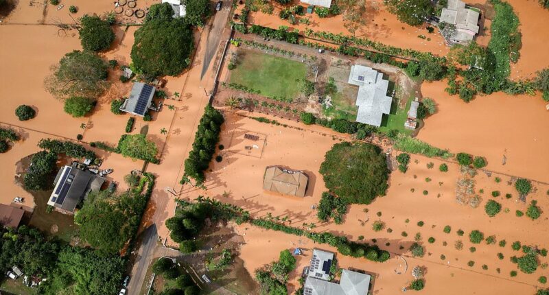 Hawaii's worst flooding in 20 years caused over $1BILLION in damage as crews desperately search for woman swept away in deluge