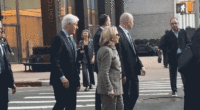 Hillary Clinton caught on video stepping back after pushy former president nudges her at busy NYC intersection