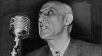 Persian Politicians; Dr. Muhammad Mossadeq -- Persia's Prime Minister and Minister of National Defence, photographed whilst delivering an impassioned radio address. June 10, 1953.