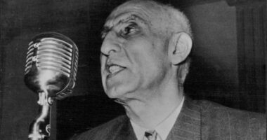 Persian Politicians; Dr. Muhammad Mossadeq -- Persia's Prime Minister and Minister of National Defence, photographed whilst delivering an impassioned radio address. June 10, 1953.