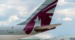 MANCHESTER, UNITED KINGDOM - AUG 07, 2015: Qatar Airways Airbus A330 tail livery at Manchester Airport Aug 07 2015.