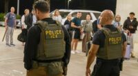 ICE agents outside Louis Armstrong International Airport.