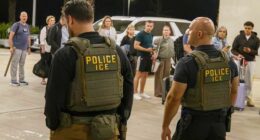 ICE agents outside Louis Armstrong International Airport.