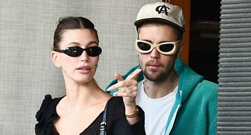 Justin Bieber can't keep his hands off wife Hailey in rare PDA moment