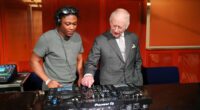 King of the decks! Charles tries his hand at DJing in Manchester - before agreeing 'it's not as easy as it looks'