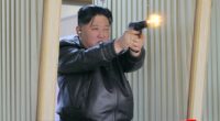 Leather-clad Kim shows off his 'excellent' small gun arsenal